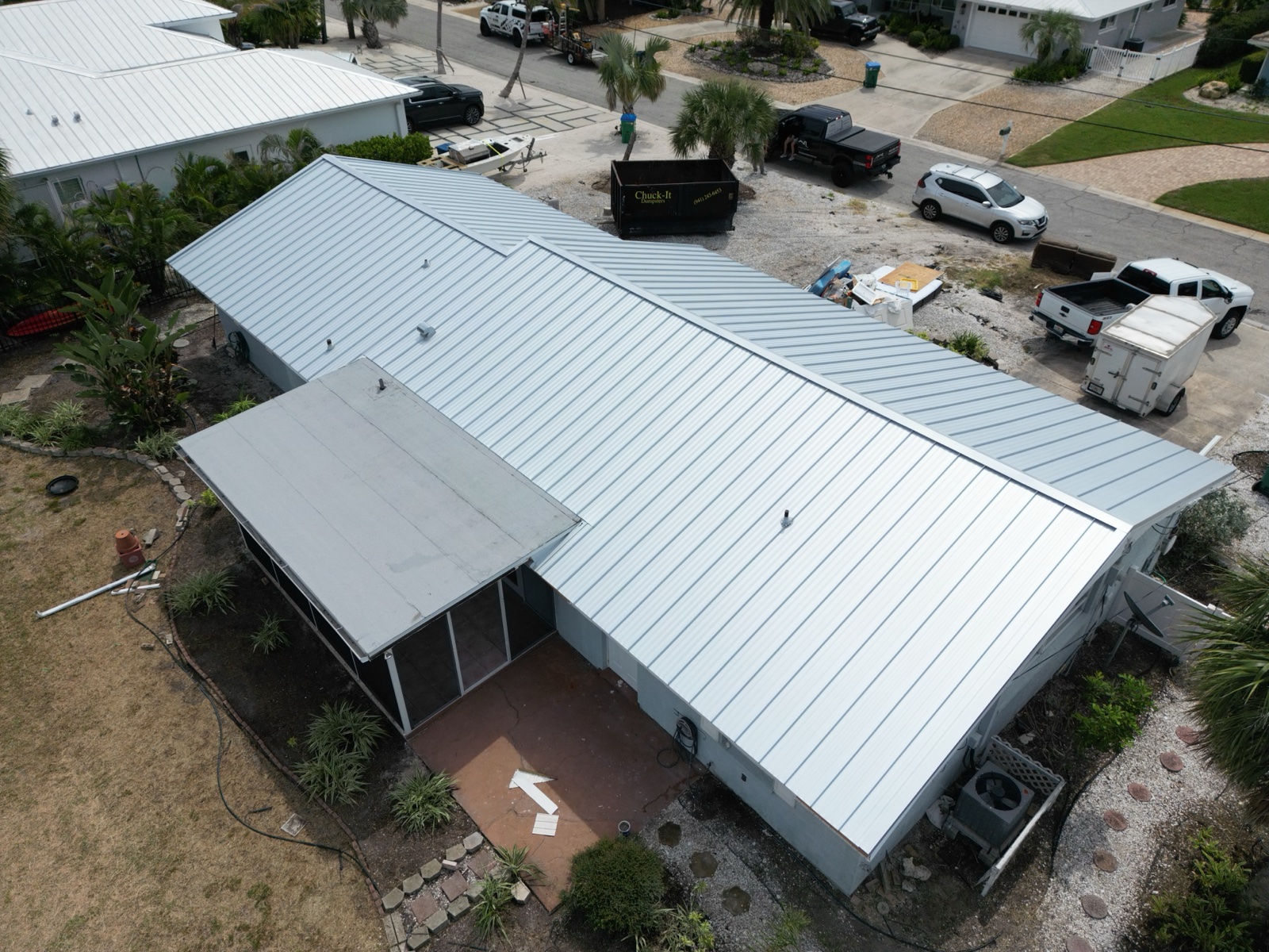 Silver standing seam metal roof installation