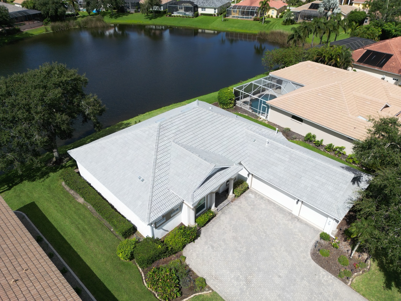 Light gray flat tile roof on a lakefront home